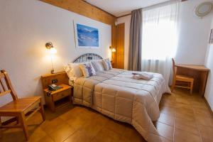 Postel nebo postele na pokoji v ubytování Hotel Iris
