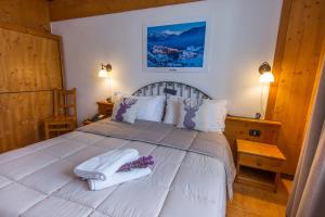 Postel nebo postele na pokoji v ubytování Hotel Iris