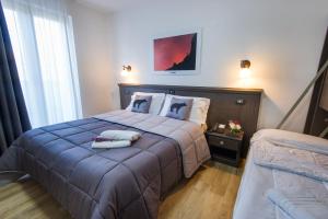 Postel nebo postele na pokoji v ubytování Hotel Iris