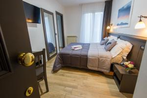 Postel nebo postele na pokoji v ubytování Hotel Iris