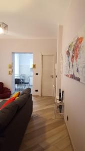 a living room with a couch and a table at Ana's Place Torino 1 in Turin