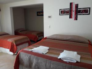 Una cama o camas en una habitación de Hotel Parador Ruta 40