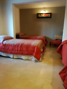 Una cama o camas en una habitación de Hotel Parador Ruta 40
