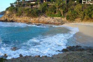 an aerial view of a beach with the ocean at Calabash Cottage in Five Islands Village