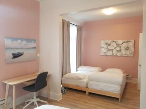 Postel nebo postele na pokoji v ubytování Ottawa Stay Downtown Suites