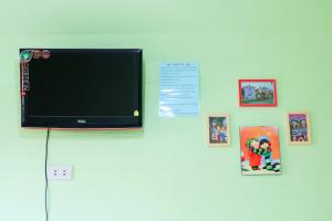 TV o dispositivi per l'intrattenimento presso A Houses Homestay