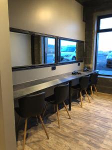 a meeting room with a long table and chairs at The Barn in Vík