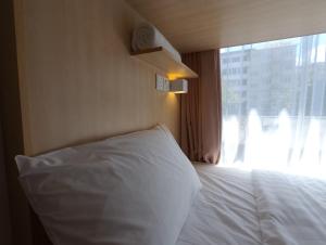 Säng eller sängar i ett rum på Signel Hostel