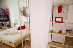a room with a bunk bed and a book shelf at La "Piccola" di Irene al Vaticano in Rome