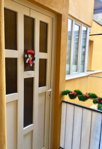 a door to a house with a wreath on it at Clyra Apartment City Centar Zagreb in Zagreb
