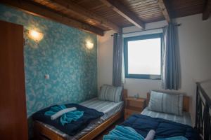 Katil atau katil-katil dalam bilik di Villa Afou +45 gambar
