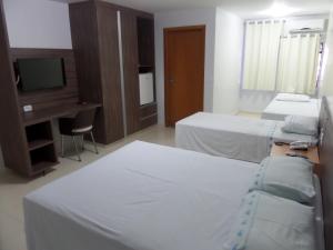 Cama ou camas em um quarto em Hotel CTC
