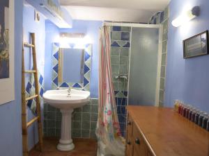 a bathroom with a sink and a shower at Maison avec jardin sur une colline in Marseille