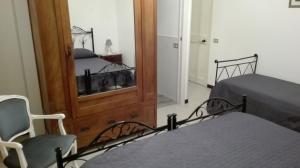 Postel nebo postele na pokoji v ubytování Kali Nitta Salento