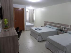 Cama ou camas em um quarto em Hotel CTC