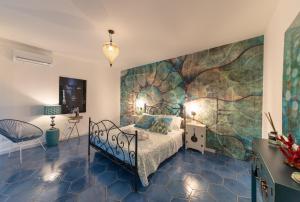 A bed or beds in a room at QuattroCuori Boutique Hotel & Spa