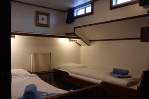 Un pat sau paturi într-o cameră la MPS Flora