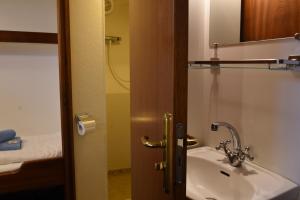 a bathroom with a sink and a mirror at MPS Flora in Amsterdam