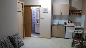 a kitchen with a sink and a counter top at Apartman Nives in Prijedor
