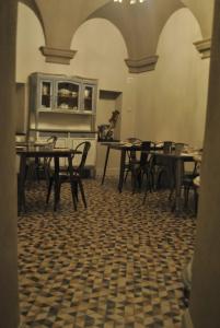 an empty dining room with tables and chairs at Locanda San Tomaso Affittacamere in Pietra Ligure