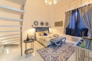 A bed or beds in a room at QuattroCuori Boutique Hotel & Spa