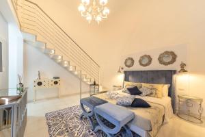 A bed or beds in a room at QuattroCuori Boutique Hotel & Spa