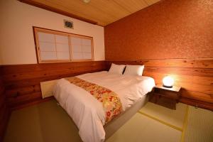 Ein Bett oder Betten in einem Zimmer der Unterkunft Raicho Lodge Madarao