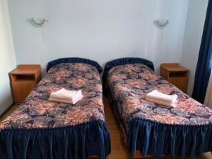 A bed or beds in a room at Inn on Zhytomyrska