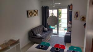 Uma área de estar em Apartamento Villa di Fiore (novissimo)