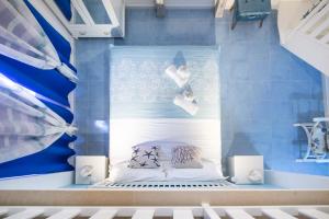 A bed or beds in a room at QuattroCuori Boutique Hotel & Spa