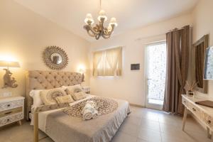 A bed or beds in a room at QuattroCuori Boutique Hotel & Spa
