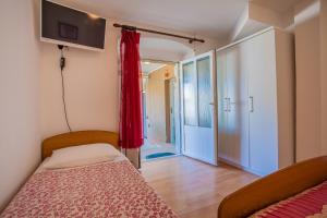 Postel nebo postele na pokoji v ubytování Apartment Surdić