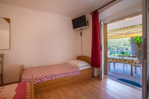 Postel nebo postele na pokoji v ubytování Apartment Surdić