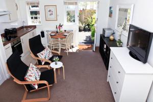 a kitchen and dining room with a table and chairs at Lowerbourne House Studio in Porlock