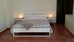 A bed or beds in a room at CASA OLEANDRO