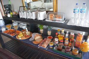 a buffet of food and drinks on a table at Sea Paradise in Wilderness