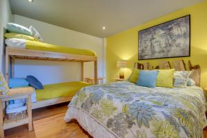 a bedroom with two bunk beds and a desk at Log Cabin Home with Lake and Mountain view by Reserver.ca in Sainte-Adèle