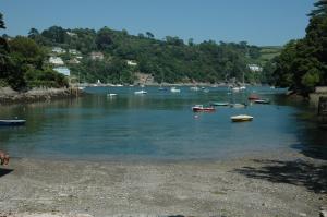 a group of boats in a river with trees at No1 The Pottery, Dartmouth in Dartmouth