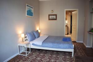 Posteľ alebo postele v izbe v ubytovaní Art apartment on Rynok Square