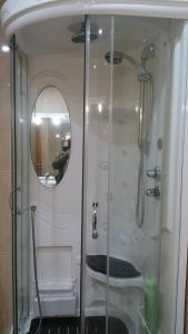 a bathroom with a shower and a mirror at Apartamento Centro Porriño in Porriño +25 photos
