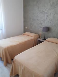 Postel nebo postele na pokoji v ubytování Villa Donati