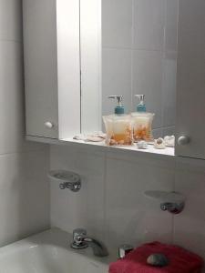 Koupelna v ubytování COMPLEJO DEPARTAMENTOS BePe FRENTE AL MAR