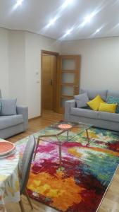 a living room filled with furniture and a couch at Apartamento Centro Porriño in Porriño