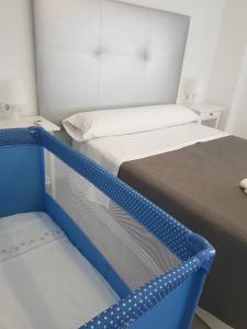 Posteľ alebo postele v izbe v ubytovaní Apartamento Gloria 1 Parking privado gratis