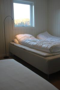 Ένα ή περισσότερα κρεβάτια σε δωμάτιο στο Bjørndalsvatnet