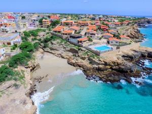 an aerial view of a village on a rocky coast at Maio Vacanze in Vila do Porto