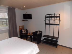 Postel nebo postele na pokoji v ubytování B&B De Linde