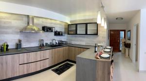 a kitchen with a sink and a counter top at Los Cristianos Best Beach View in Arona