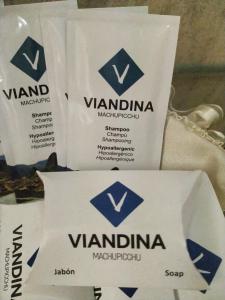 a group of packages of vondana moisturizers on a table at Viandina Machupicchu in Machu Picchu
