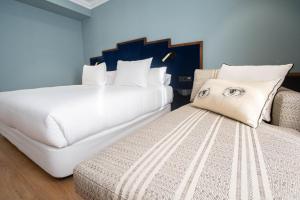 Cama o camas de una habitación en Soho Boutique Congreso